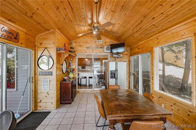 35 Port Bagnell W, Eldon, MO 65026 - dining area with wooden walls, lofted ceiling, light tile patterned floors, ceiling fan, and wooden ceiling