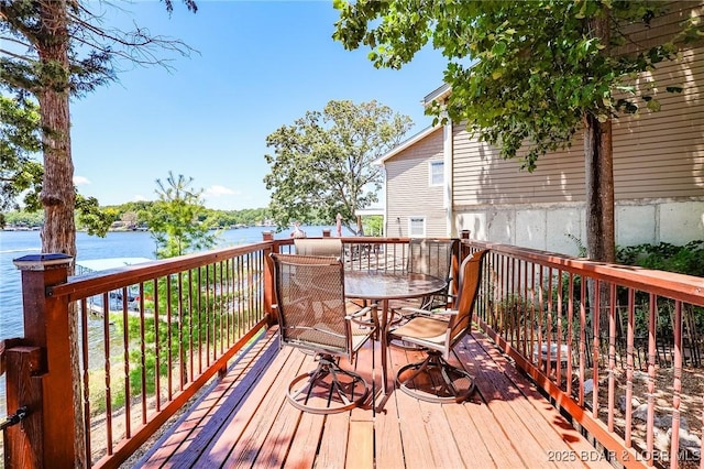35 Port Bagnell W, Eldon, MO 65026 - wooden terrace featuring a water view and outdoor dining space