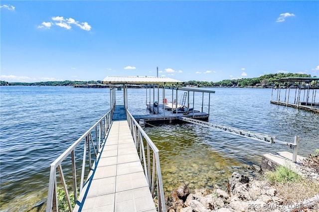 35 Port Bagnell W, Eldon, MO 65026 - dock area featuring a water view and boat lift