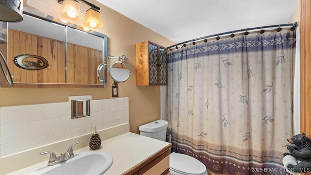 27527 Clyne Dr, Barnett, MO 65011 - full bathroom featuring vanity, a shower with shower curtain, and backsplash