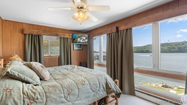 27527 Clyne Dr, Barnett, MO 65011 - bedroom with wooden walls, a water view, and ceiling fan