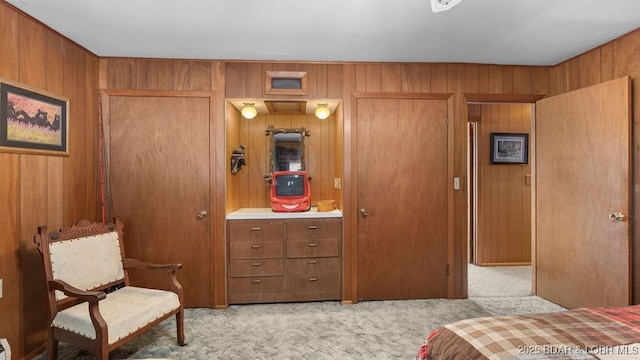 27527 Clyne Dr, Barnett, MO 65011 - bedroom featuring light colored carpet and wood walls