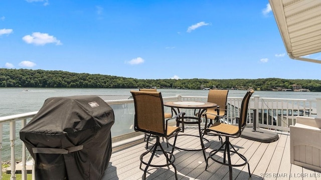 27527 Clyne Dr, Barnett, MO 65011 - wooden terrace featuring a grill, a forest view, and a water view