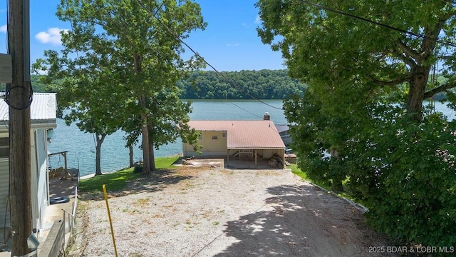 27527 Clyne Dr, Barnett, MO 65011 - view of front facade featuring a water view and a metal roof