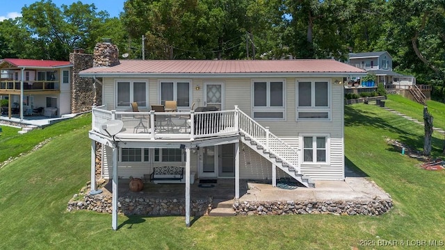 27527 Clyne Dr, Barnett, MO 65011 - rear view of property with stairs, a patio area, and a yard