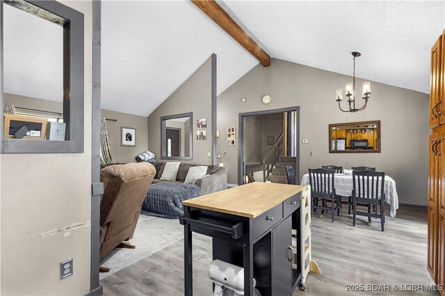 4741 Clearwood Ln, Osage Beach, MO 65065 - kitchen featuring light wood finished floors, a chandelier, beamed ceiling, open shelves, and decorative light fixtures
