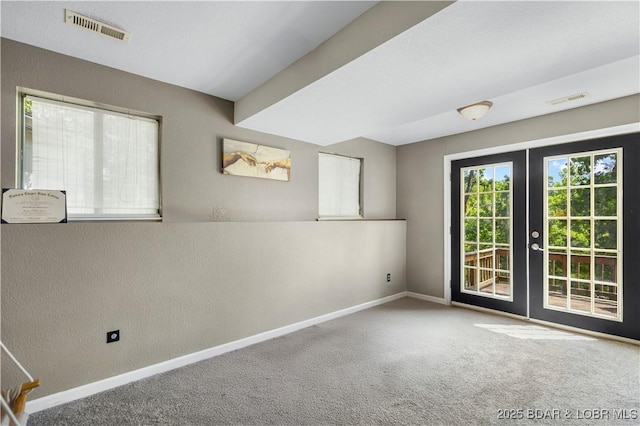 4741 Clearwood Ln, Osage Beach, MO 65065 - carpeted empty room featuring french doors and a textured wall