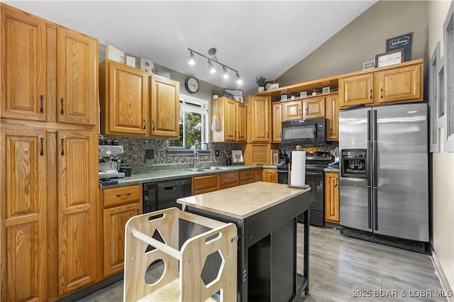 4741 Clearwood Ln, Osage Beach, MO 65065 - kitchen featuring black appliances, backsplash, lofted ceiling, open shelves, and light wood-type flooring