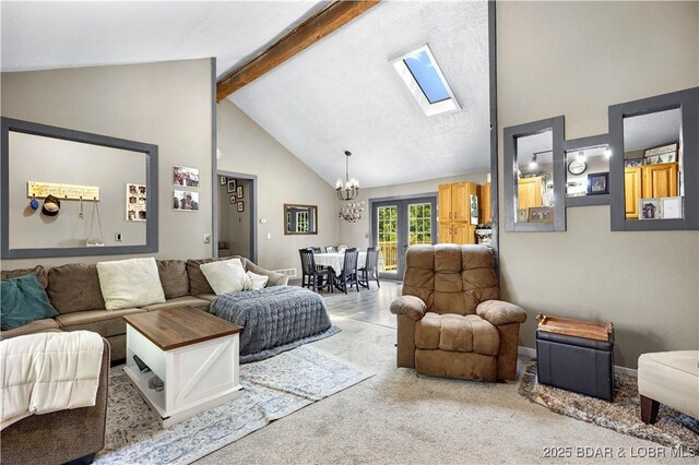 4741 Clearwood Ln, Osage Beach, MO 65065 - living room featuring a chandelier, high vaulted ceiling, a skylight, beamed ceiling, and carpet flooring