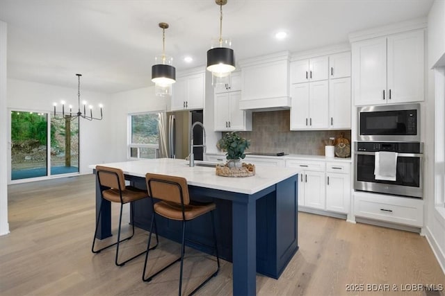 30586 Rapids Holw, Stover, MO 65037 - kitchen featuring stainless steel appliances, decorative backsplash, light countertops, white cabinetry, and recessed lighting