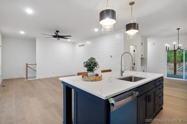 30586 Rapids Holw, Stover, MO 65037 - kitchen with stainless steel dishwasher, light wood-style flooring, a ceiling fan, hanging light fixtures, and recessed lighting