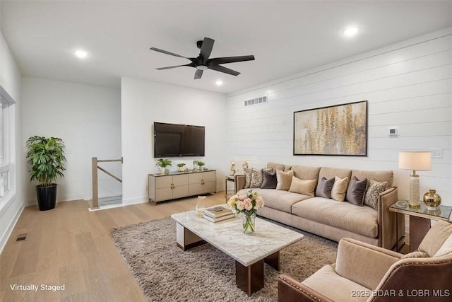 30586 Rapids Holw, Stover, MO 65037 - living room with a ceiling fan, light wood-style flooring, recessed lighting, and wooden walls