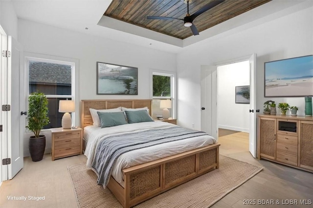 30586 Rapids Holw, Stover, MO 65037 - bedroom featuring a tray ceiling, wood finished floors, and ceiling fan