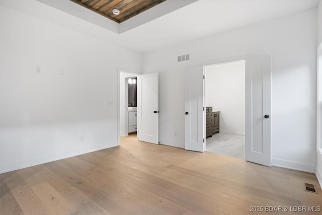 30586 Rapids Holw, Stover, MO 65037 - unfurnished bedroom with light wood-type flooring and ensuite bathroom
