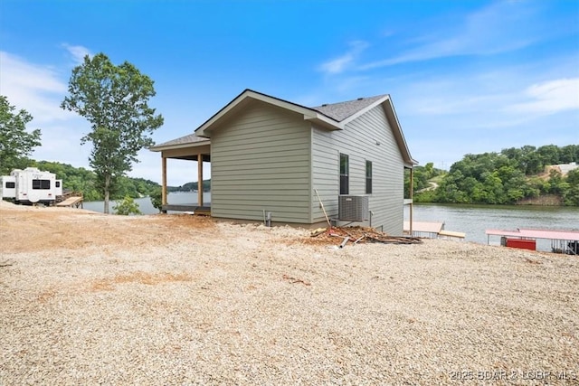30586 Rapids Holw, Stover, MO 65037 - view of home's exterior featuring a water view and a boat dock