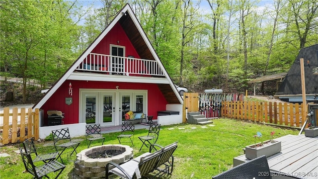 27086 Comanche Cv, Rocky Mount, MO 65072 - back of house with french doors, a fire pit, and a deck