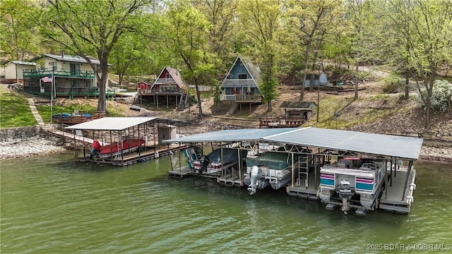 27086 Comanche Cv, Rocky Mount, MO 65072 - dock area featuring boat lift and a water view