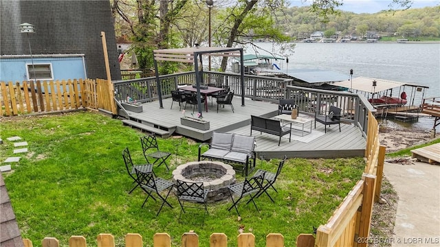 27086 Comanche Cv, Rocky Mount, MO 65072 - view of yard with an outdoor fire pit, a deck with water view, and a boat dock