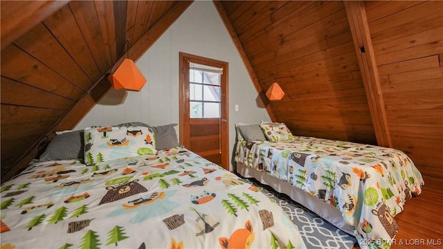 27086 Comanche Cv, Rocky Mount, MO 65072 - bedroom with lofted ceiling, wooden ceiling, wood finished floors, and wood walls