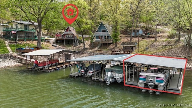27086 Comanche Cv, Rocky Mount, MO 65072 - dock area featuring boat lift and a water view