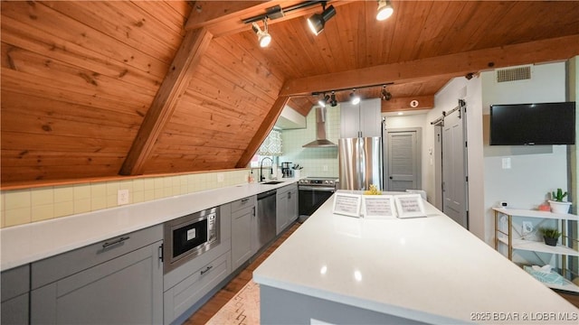 27086 Comanche Cv, Rocky Mount, MO 65072 - kitchen featuring track lighting, gray cabinetry, wooden ceiling, wood finished floors, and stainless steel appliances