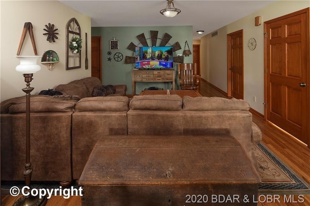 living room with dark hardwood / wood-style floors