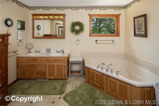 bathroom with double sink vanity, tile flooring, and a tub