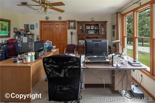 office featuring ceiling fan and light colored carpet