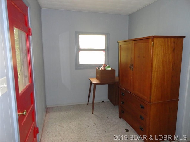 office space with light colored carpet