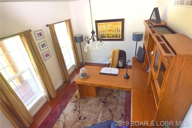 home office featuring dark hardwood / wood-style flooring