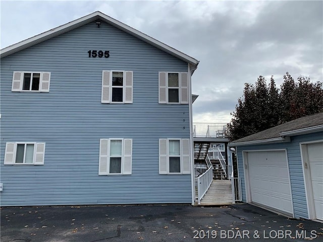 view of property exterior with a garage