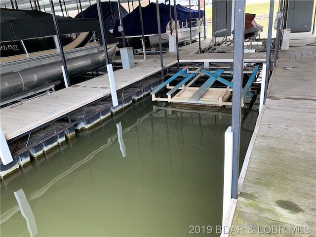 dock area featuring a water view