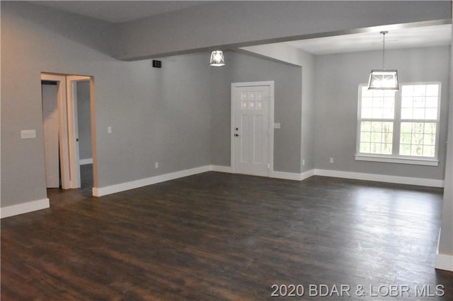 spare room featuring dark hardwood / wood-style floors