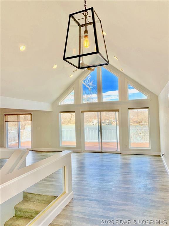 interior space featuring plenty of natural light, a chandelier, and light hardwood / wood-style floors