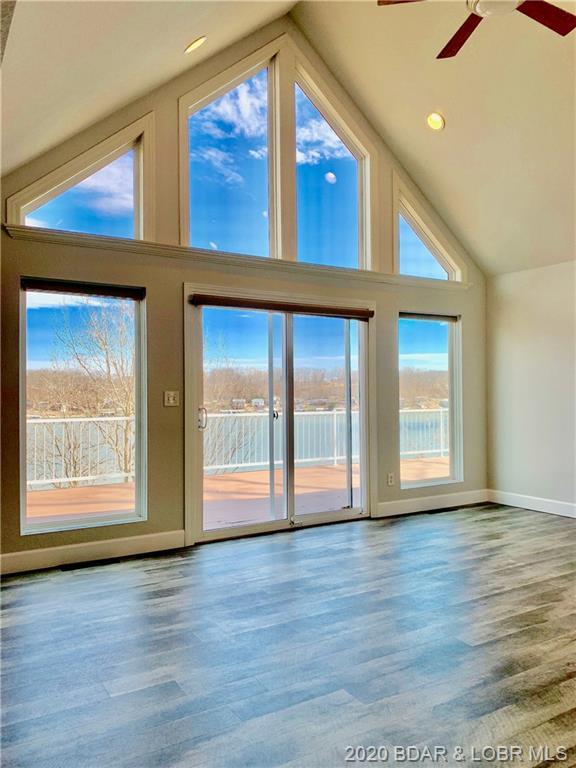 interior space featuring a healthy amount of sunlight, ceiling fan, and light hardwood / wood-style flooring