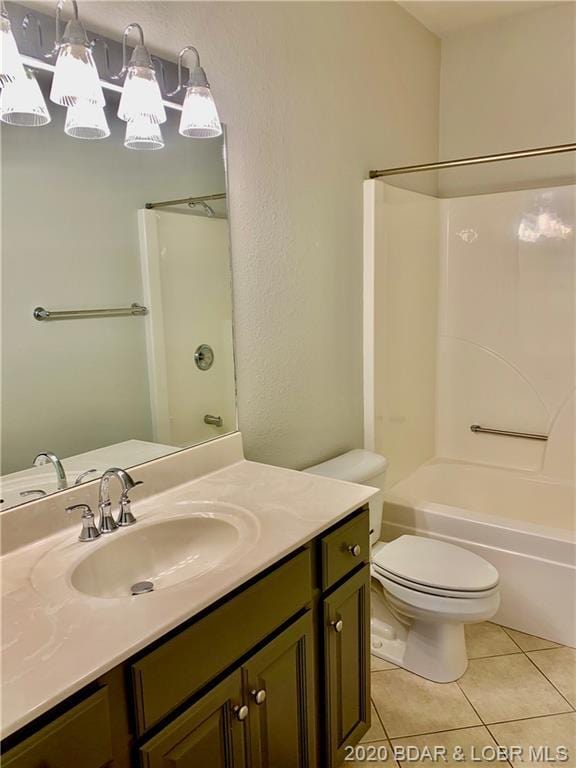 full bathroom with vanity, tile flooring, shower / bathing tub combination, and toilet