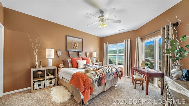 carpeted bedroom featuring ceiling fan