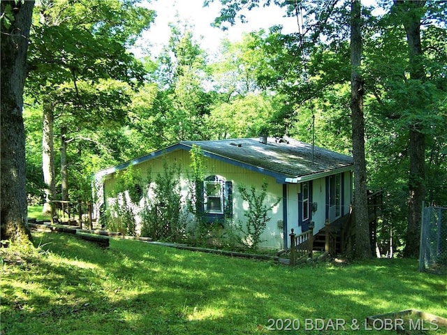 view of property exterior featuring a yard