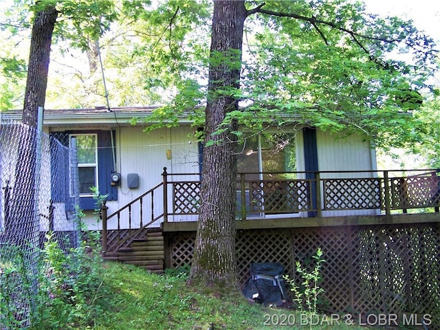 rear view of house with a wooden deck