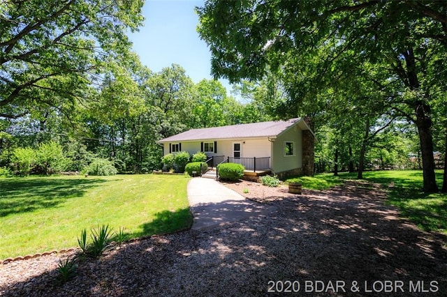 single story home featuring a front yard