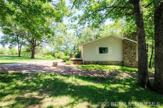 view of yard featuring a wooden deck