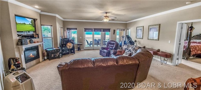 carpeted living room featuring ceiling fan and crown molding