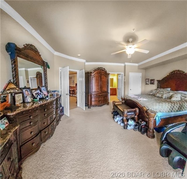 carpeted bedroom with ceiling fan and crown molding