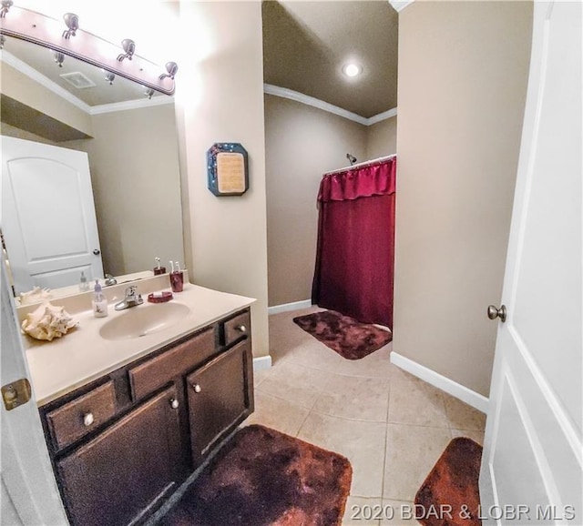 bathroom with ornamental molding, tile floors, and oversized vanity