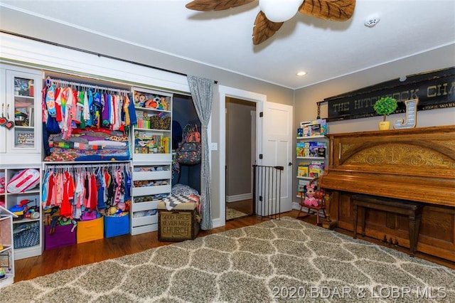 bedroom with ceiling fan and dark hardwood / wood-style flooring