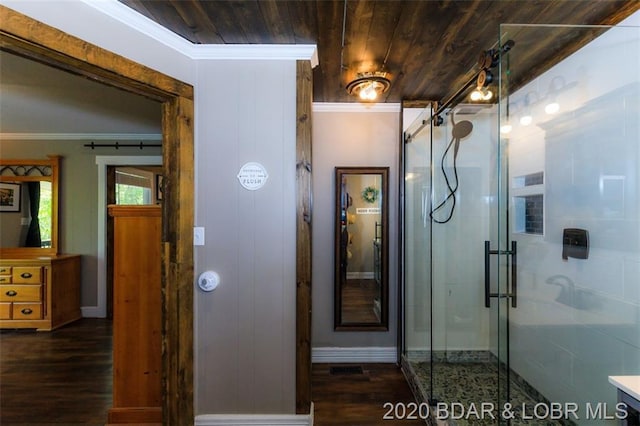 bathroom with wood ceiling, a shower with shower door, and hardwood / wood-style floors