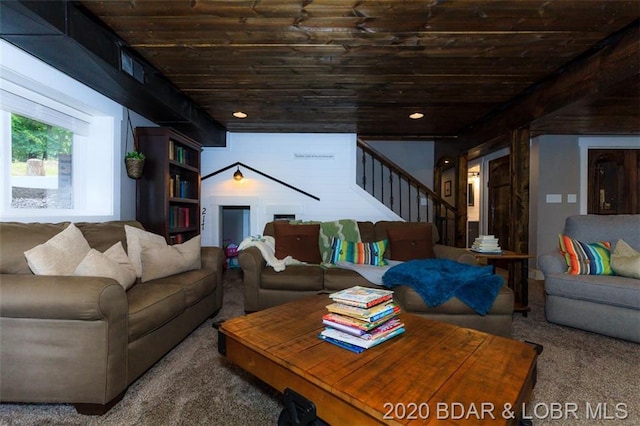 living room featuring dark carpet and wood ceiling