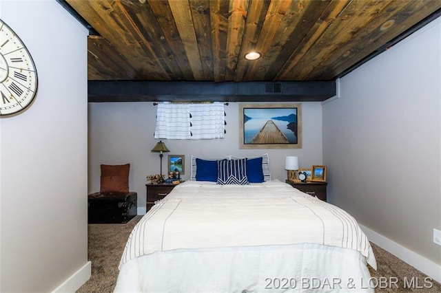 bedroom with wood ceiling and dark colored carpet