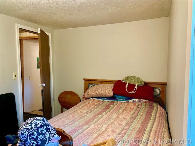 bedroom featuring a textured ceiling