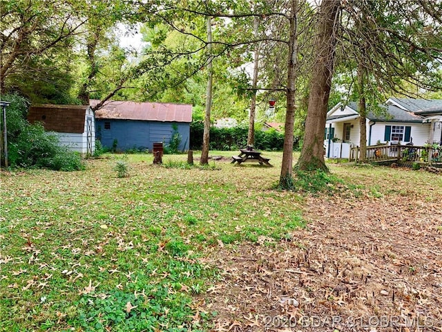 view of yard featuring a wooden deck